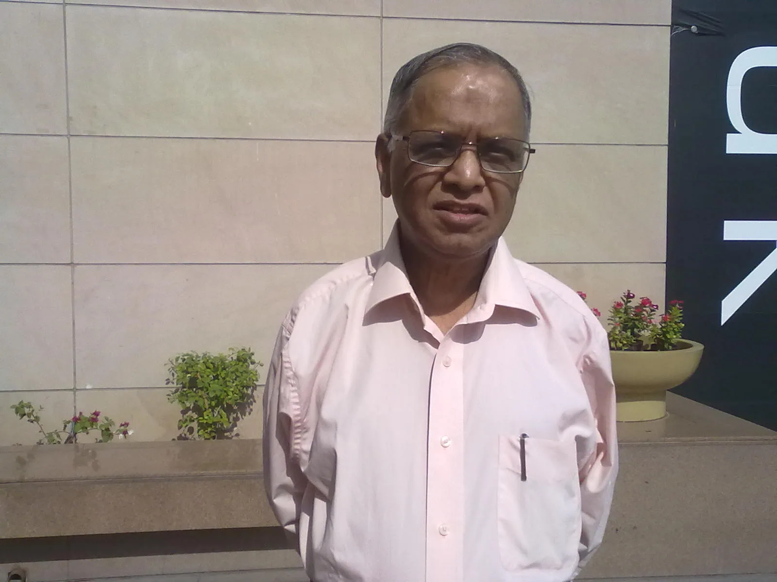 N R Narayana Murthy infront of a Movie Theater in Ahmedabad on April-2015.