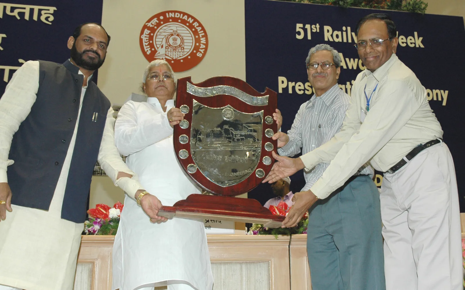 Lalu Prasad presenting the Outstanding Service Award to Railwaymen on the occasion of the 51st Railway Week, in New Delhi on April 10, 2006. The Minister of State for Railways, Shri Naranbhai J. Rathw